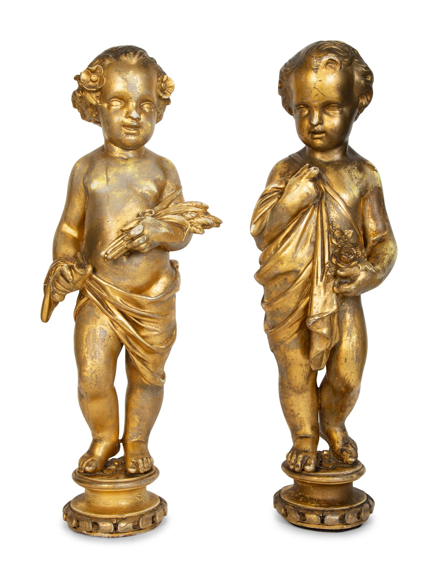 A Pair of Continental Giltwood Figures of Putti