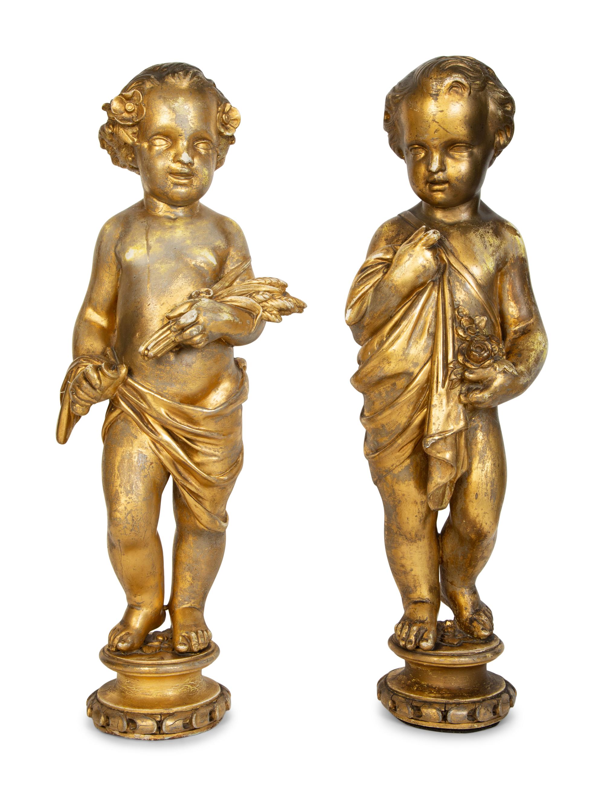 A Pair of Continental Giltwood Figures of Putti