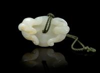 A Carved Jade Toggle Length 2 inches.