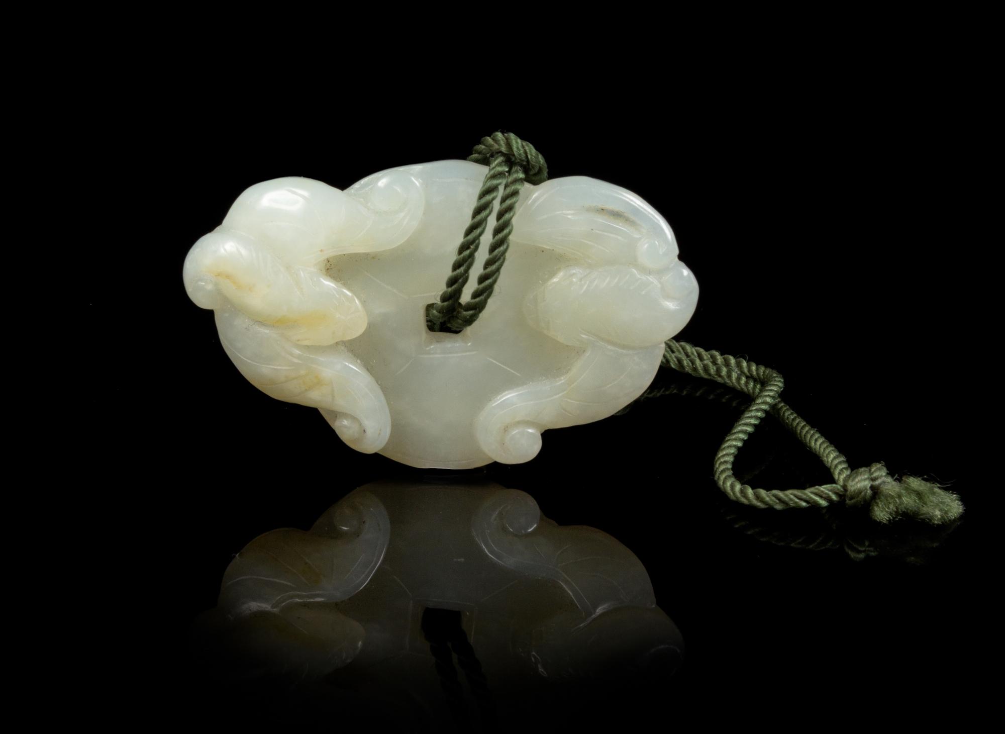 A Carved Jade Toggle Length 2 inches.