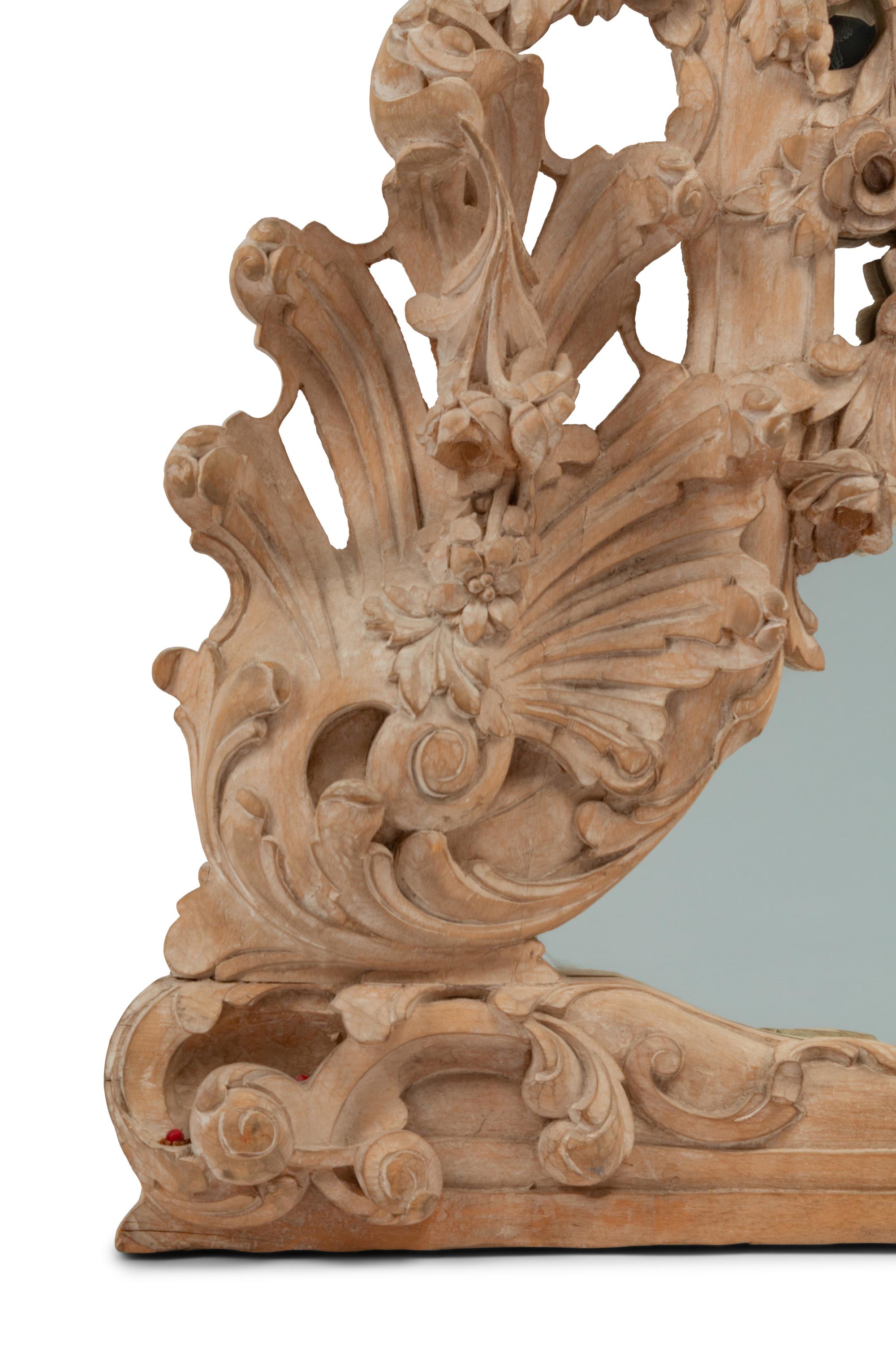 A German Rococo Style Limed Wood Overmantel Mirror