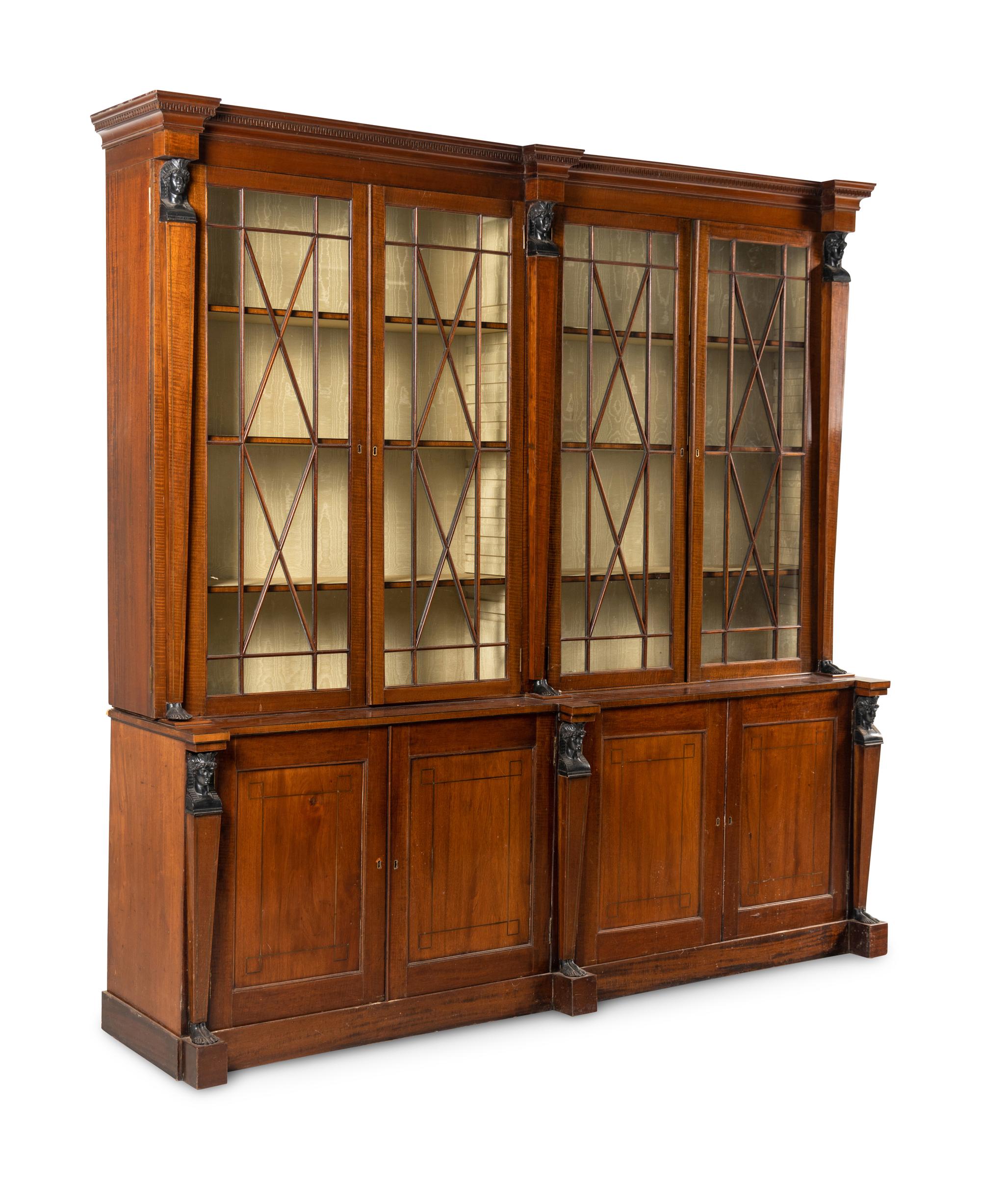 A Regency Part Ebonized Mahogany Breakfront Bookcase