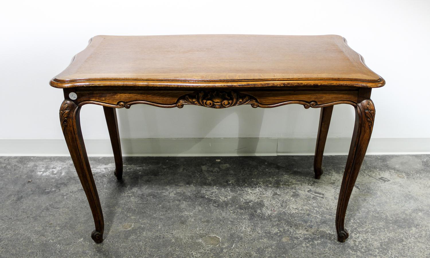 A Louis XV Style Oak Table Height 26 1/2 x width 40 1/2 x depth 21 inches. — FIRST HALF 20TH CENTURY
