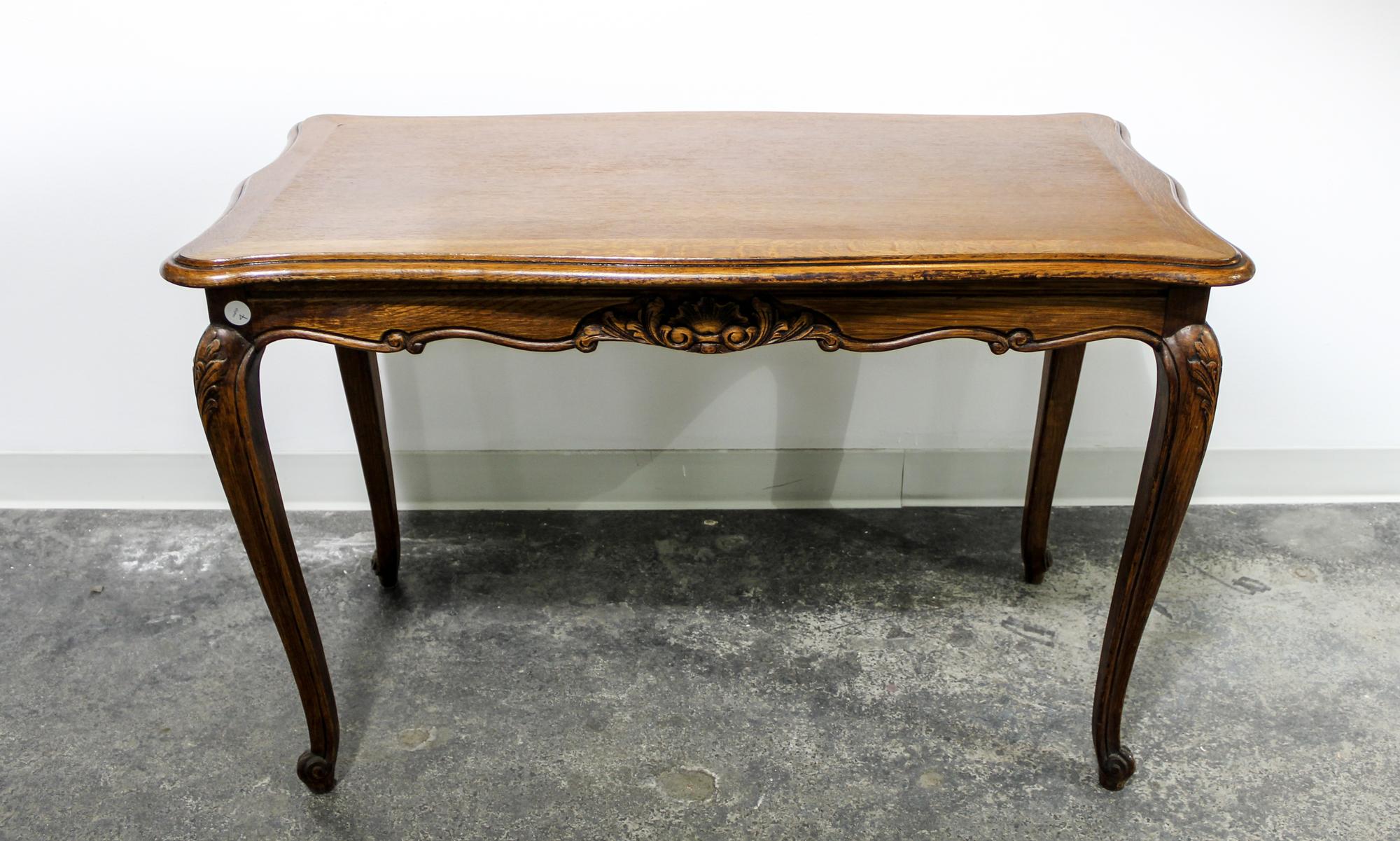 A Louis XV Style Oak Table Height 26 1/2 x width 40 1/2 x depth 21 inches. — FIRST HALF 20TH CENTURY