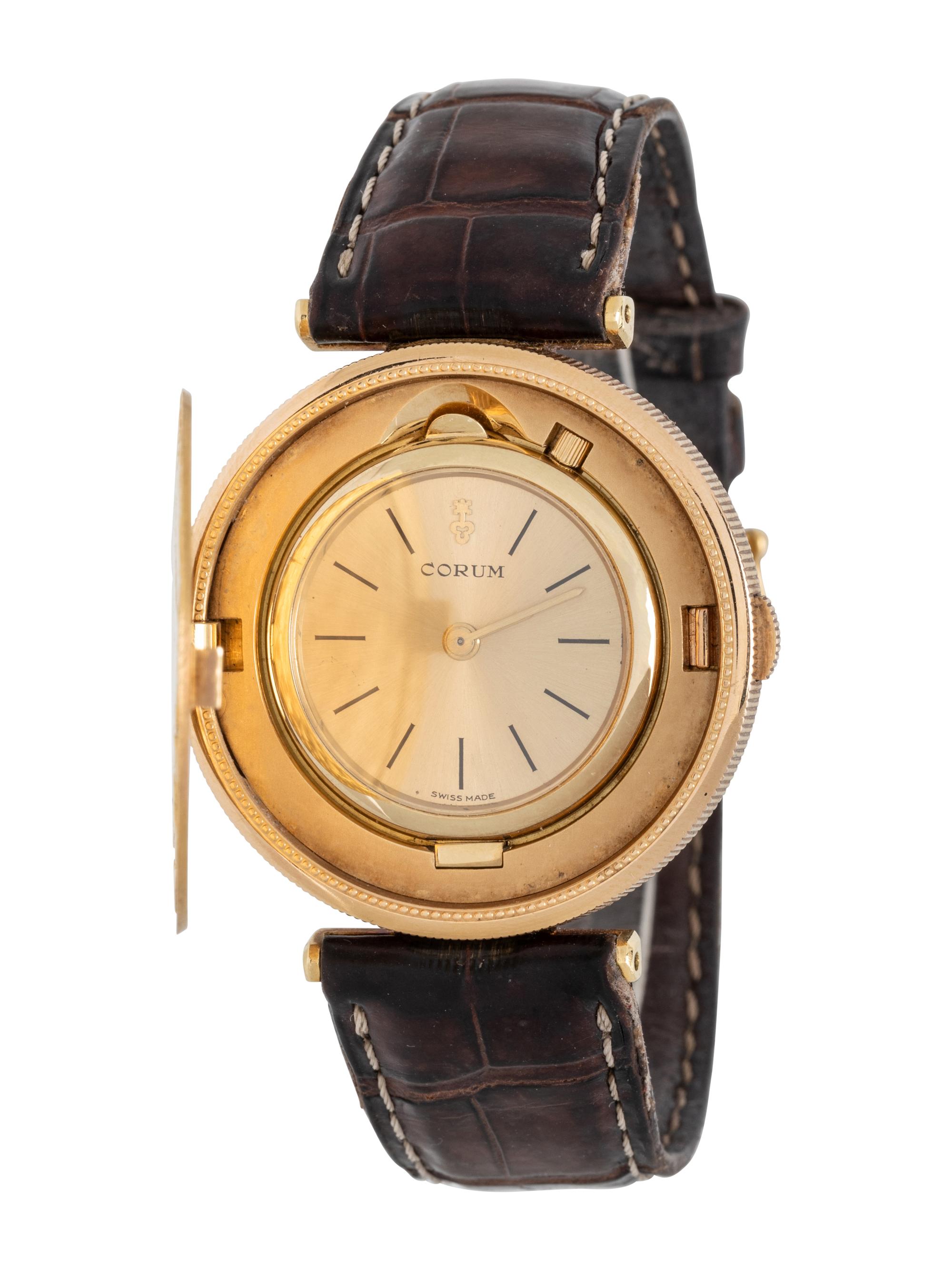 CORUM, 18K YELLOW GOLD HIDDEN DIAL COIN WATCH