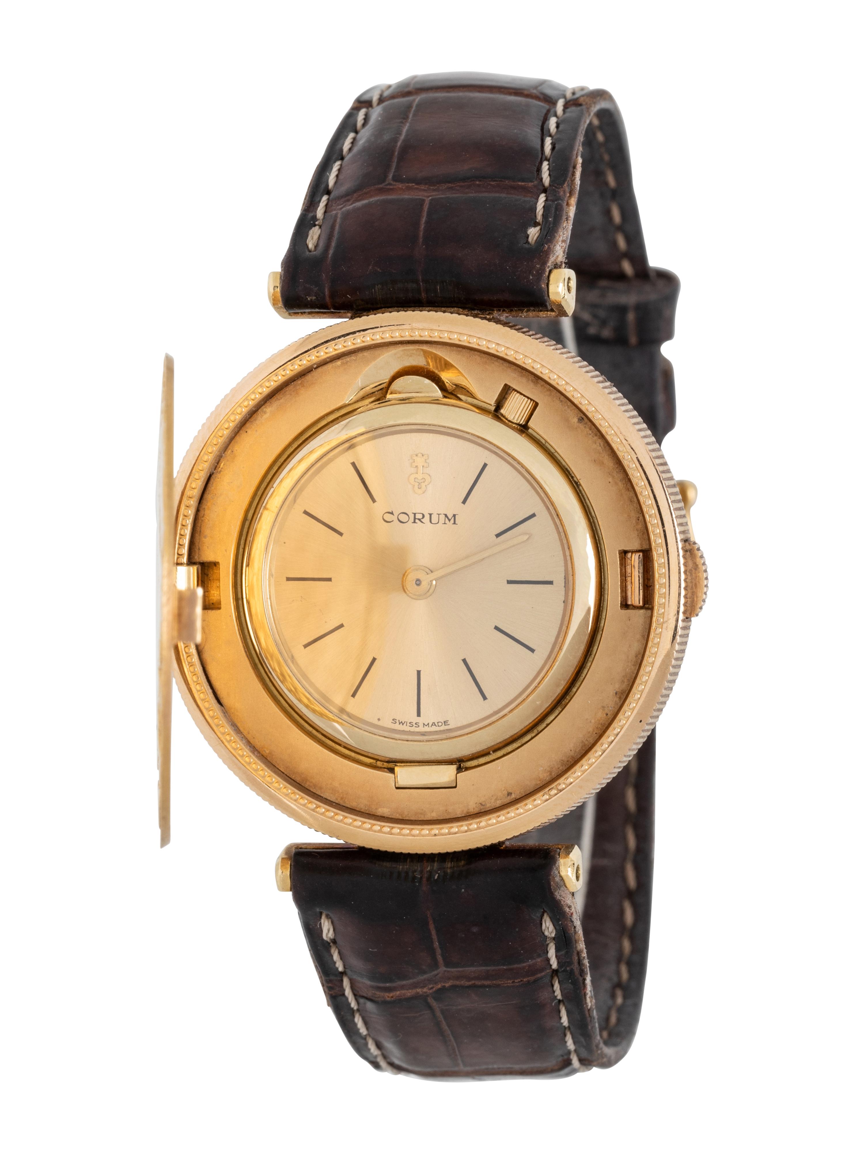 CORUM, 18K YELLOW GOLD HIDDEN DIAL COIN WATCH