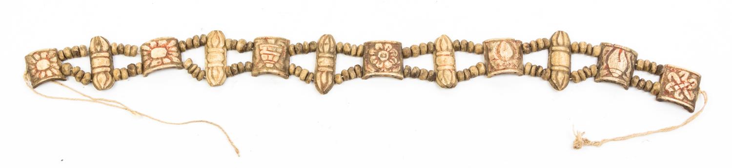 A String of Tibetan Carved Bone Beads Length 20 inches.