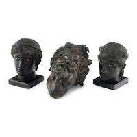 A Group of Three Greek Style Bronze Heads