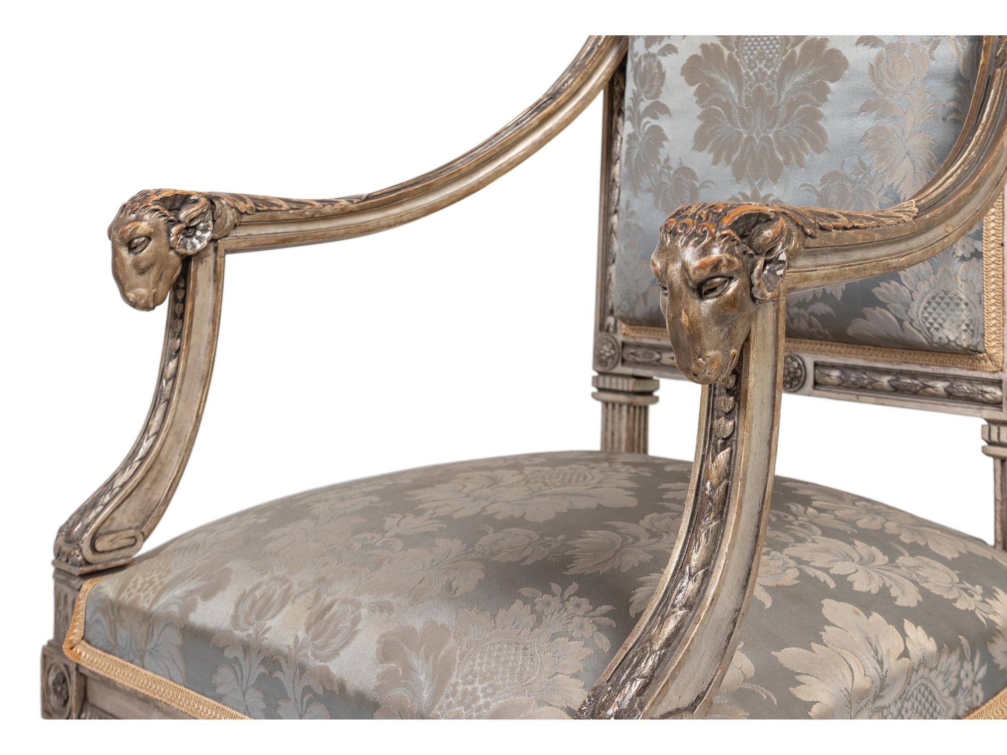 A Pair of Louis XVI Style Carved and Silver Paint Decorated Fauteuils