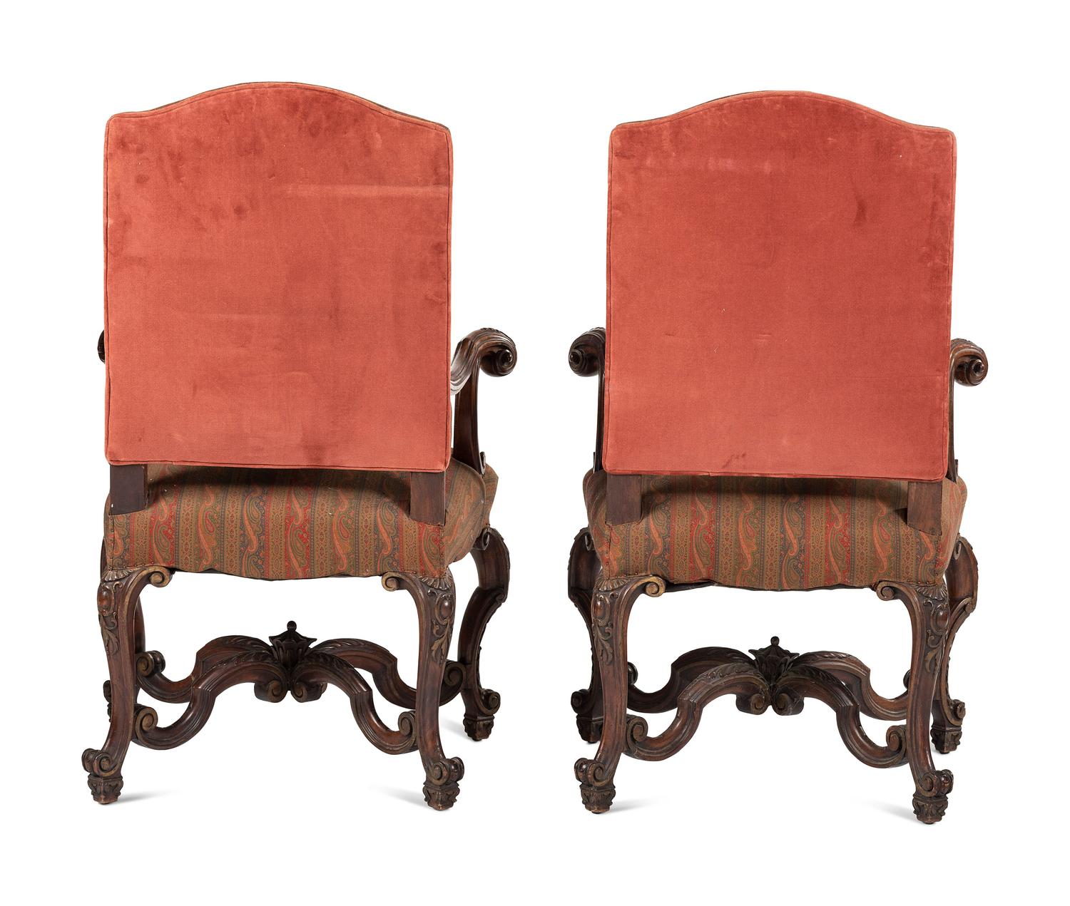 A Pair of Louis XV Style Carved Walnut Fauteuils