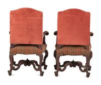 A Pair of Louis XV Style Carved Walnut Fauteuils