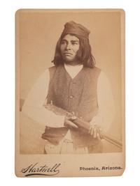 [NATIVE AMERICANS]. HARTWELL, F.A., photographer. Cabinet card of armed Apache subject identified as Chappo. Phoenix, AZ.