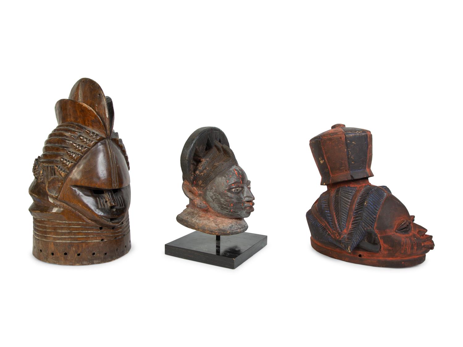 A Group of Three Helmet Masks from Tribes of West Africa — 20TH CENTURY