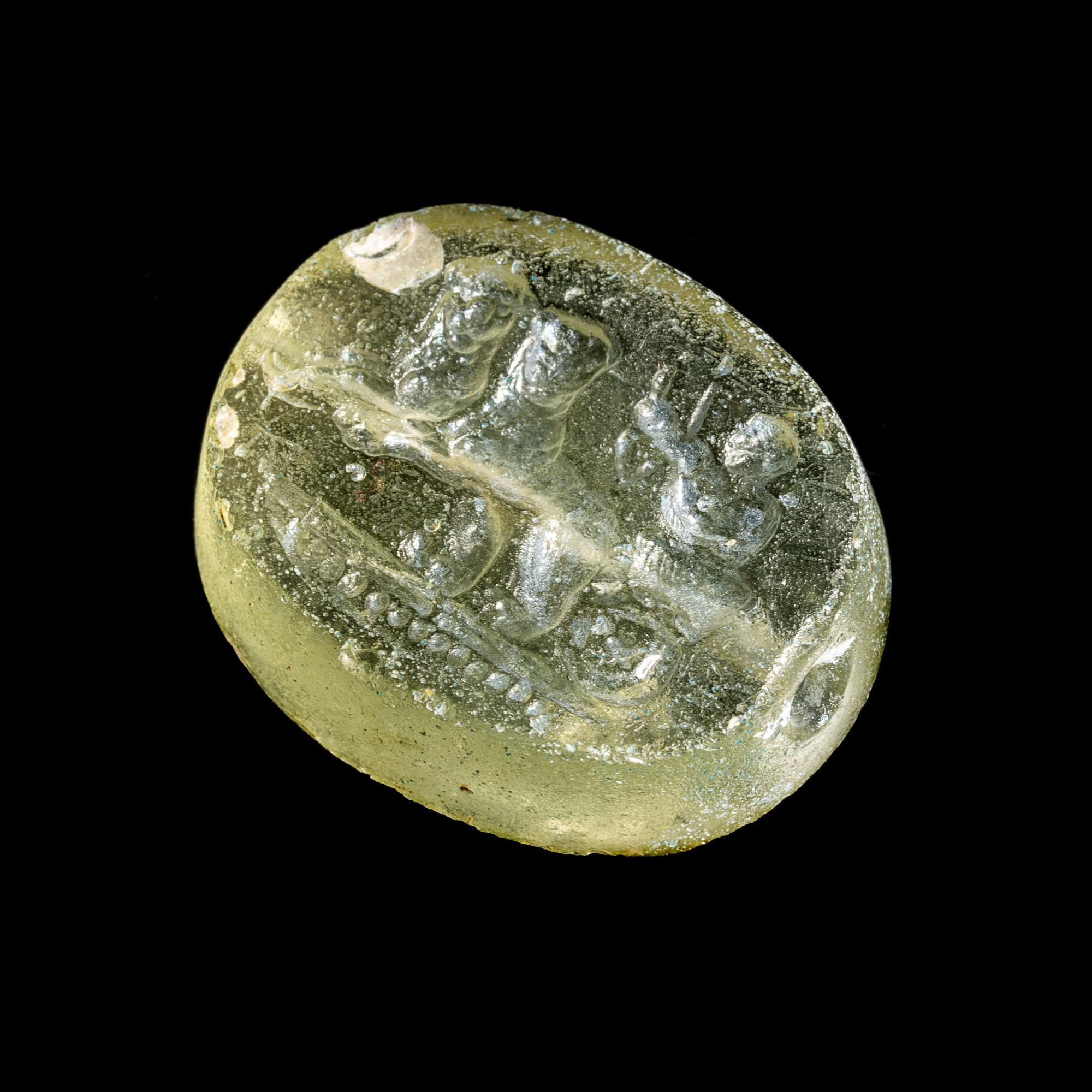 A Greek Glass Scaraboid with the God Dionysos Driving a Biga Chariot Pulled by Panthers