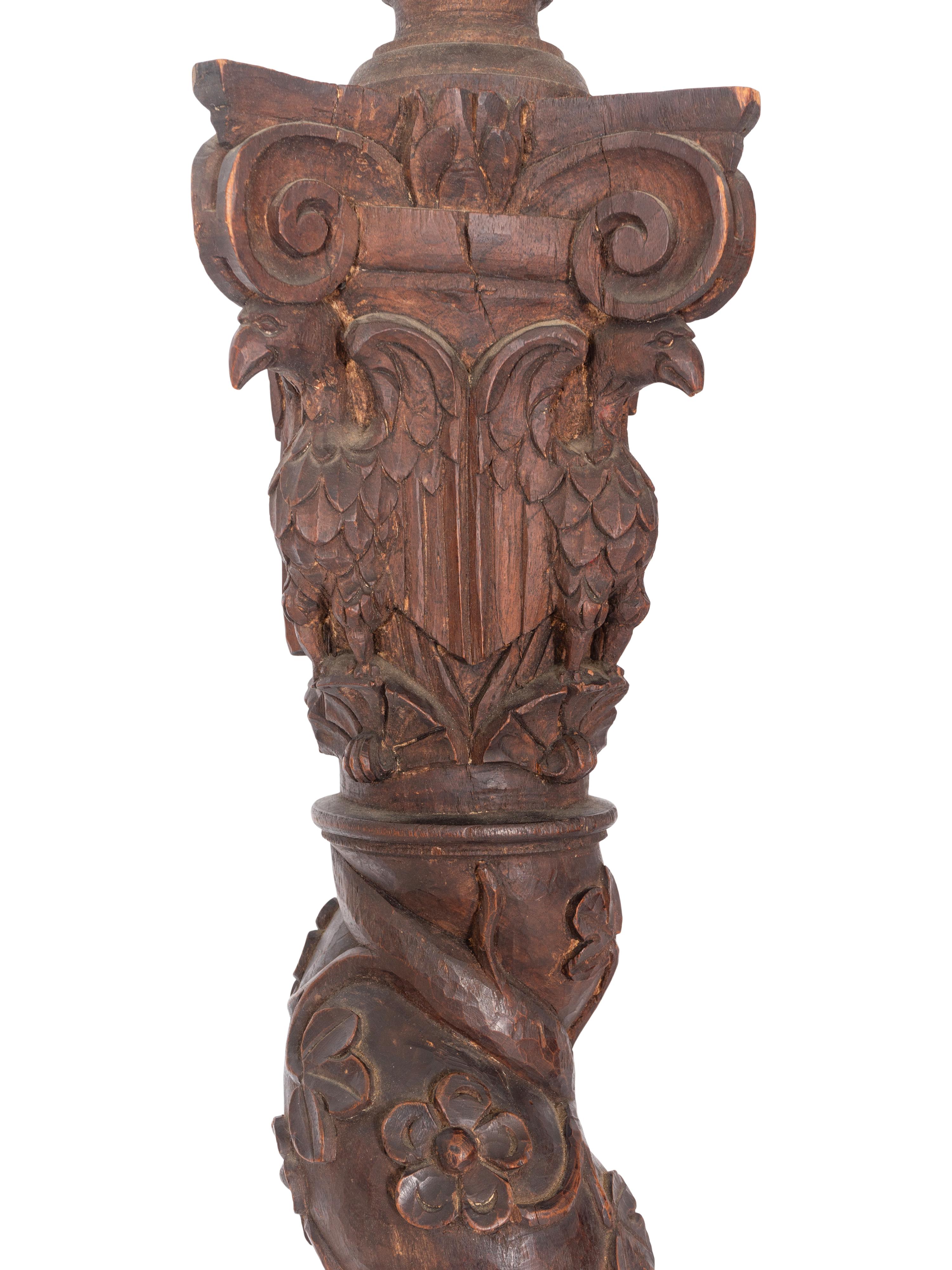 A Set of Four Continental Baroque Carved Walnut Bed Posts