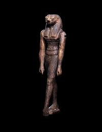 An Egyptian Wood Striding Montu