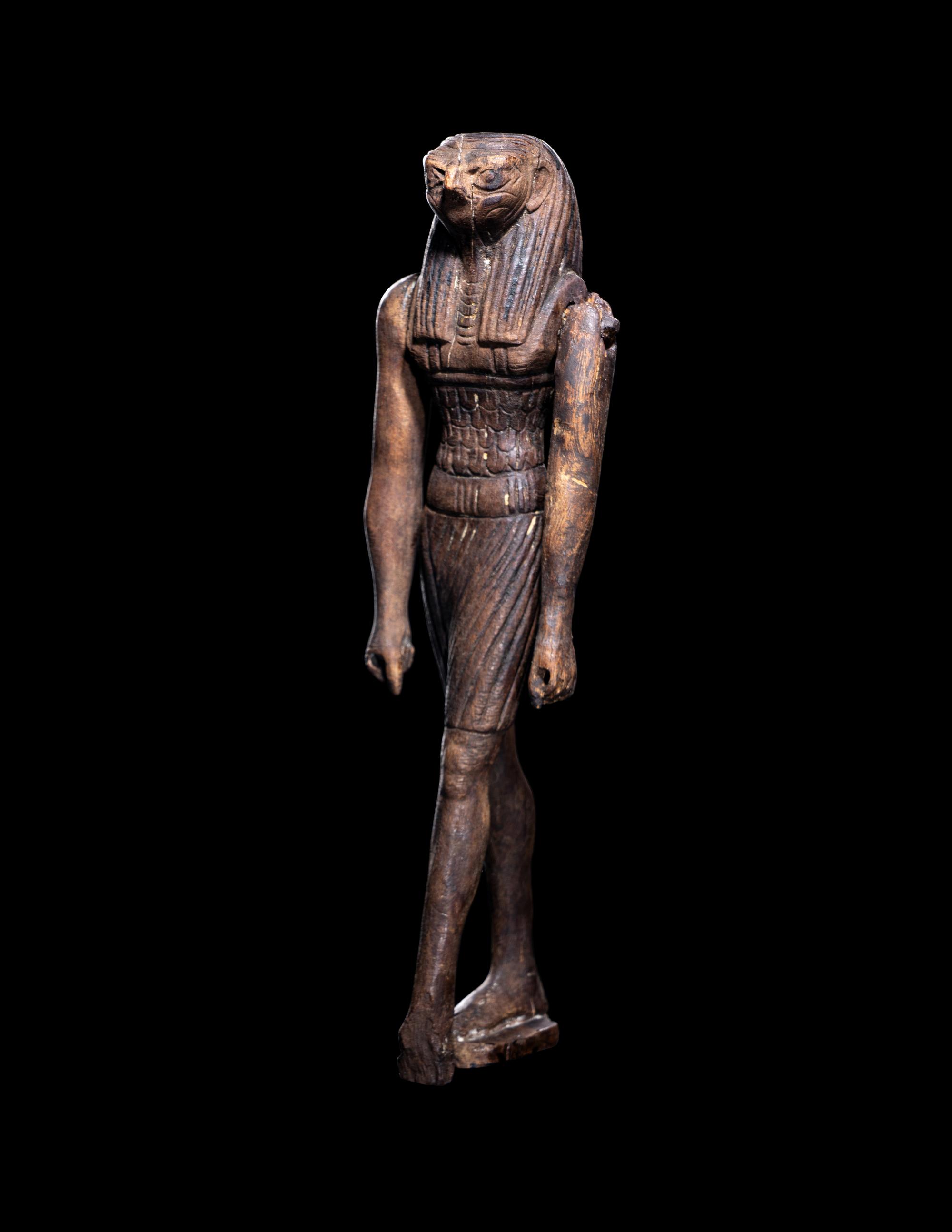 An Egyptian Wood Striding Montu