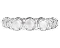A Set of Twelve Georg Jensen Silver Bread Plates