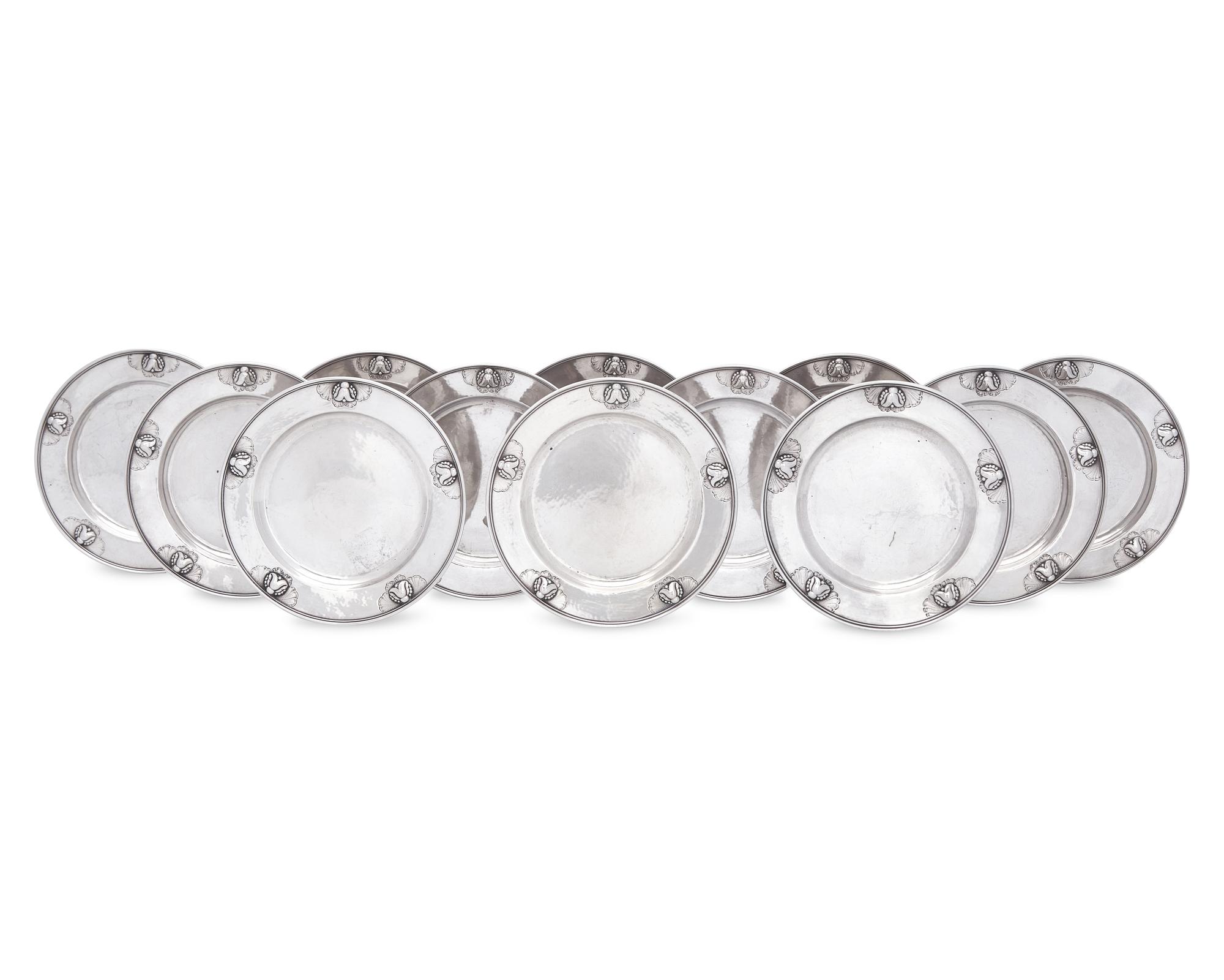 A Set of Twelve Georg Jensen Silver Bread Plates