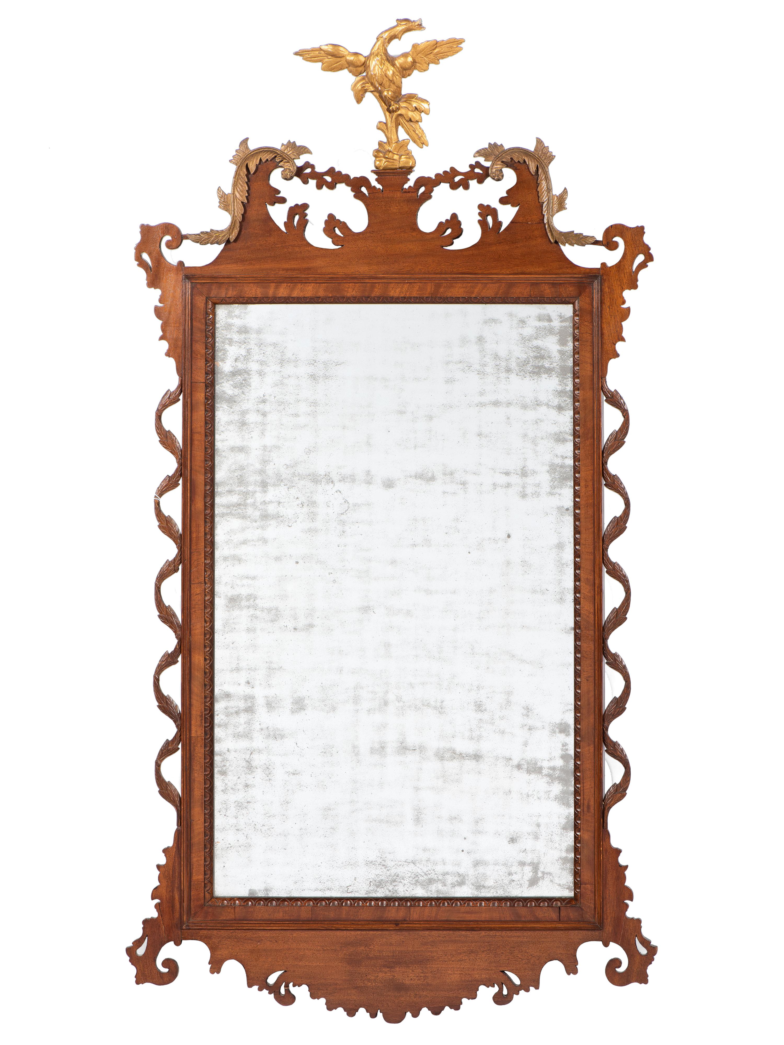 A Rare Chippendale Parcel-Gilt and Carved Mahogany Vine Looking Glass