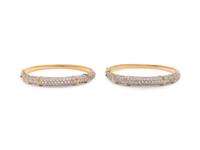 PAIR OF BICOLOR GOLD AND DIAMOND BANGLE BRACELETS