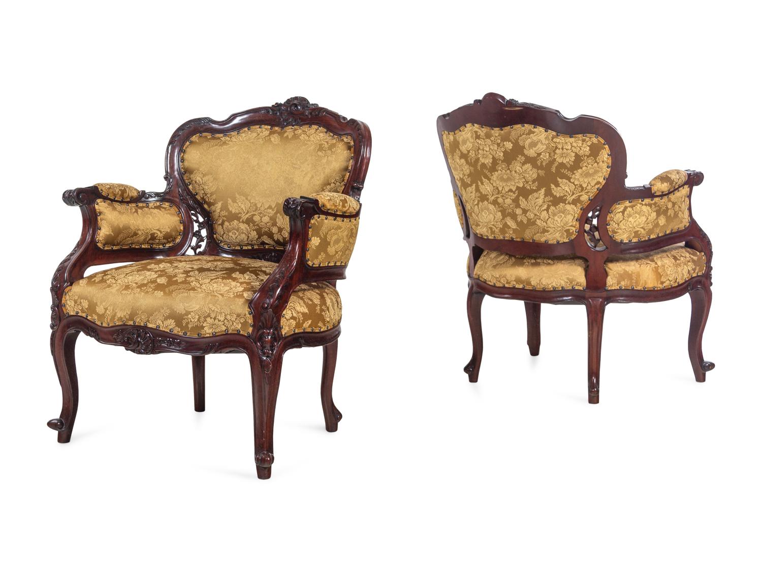 A Set of Four Rococo Style Upholstered Mahogany Armchairs