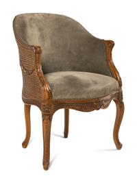 A Louis XVI Style Carved Beechwood and Caned Bergère