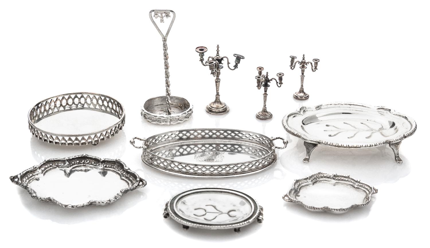 A Collection of English Silver Serving Trays, Various Makers, comprising a two-handled tray with a pierced gallery and centered by a co