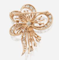 A diamond and bicolor gold brooch