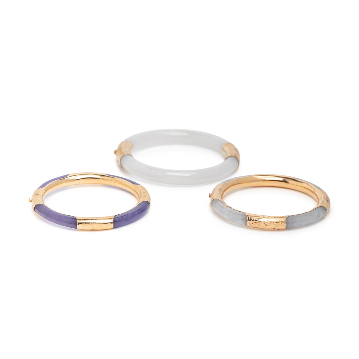 THREE JADE AND YELLOW GOLD BANGLE BRACELETS
