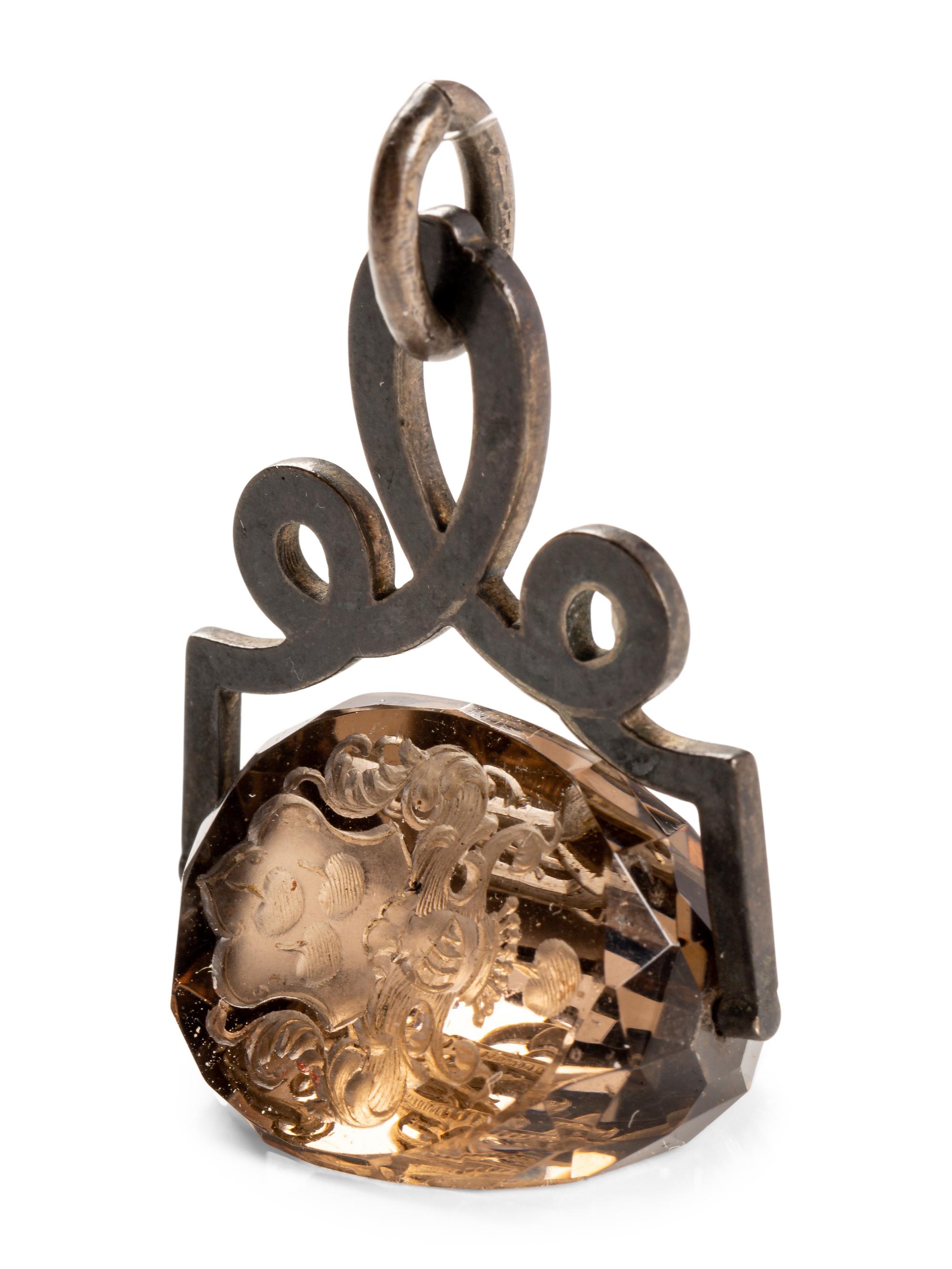 A German Carved Topaz and Gilt Metal Mounted Hand Seal