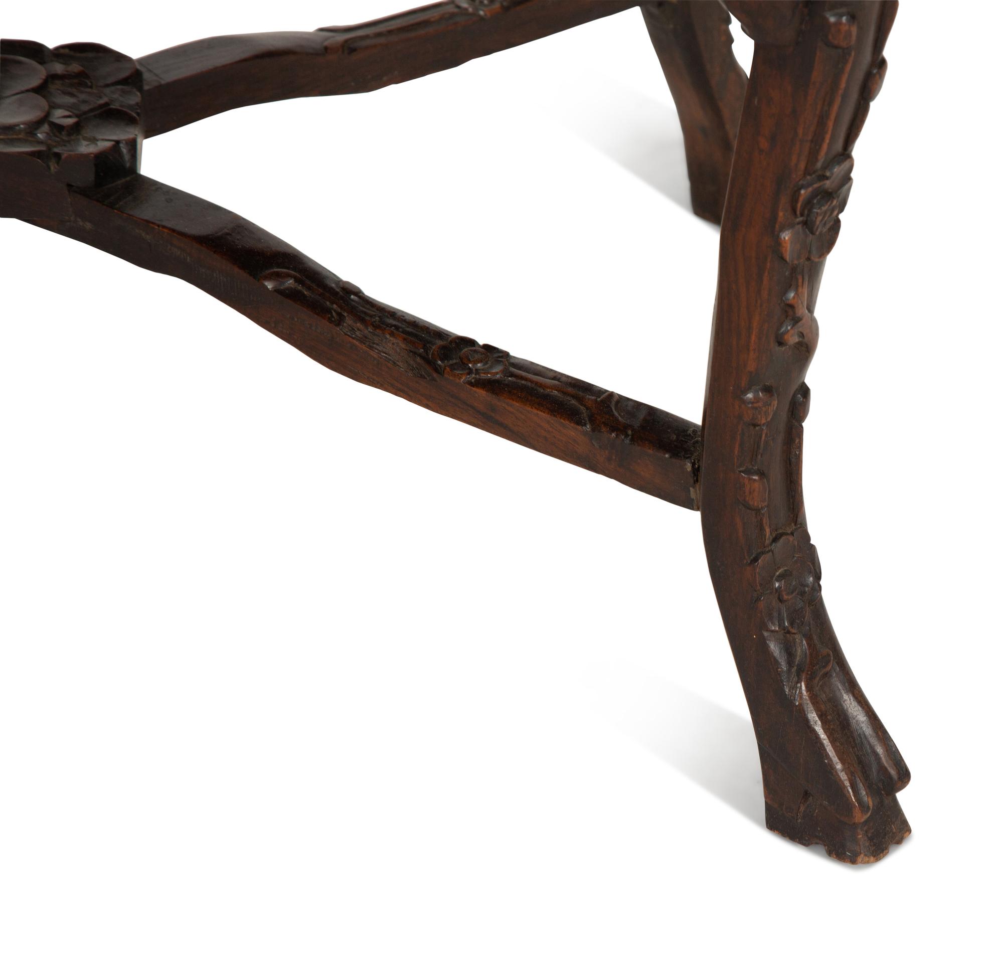 A Chinese Carved Hardwood Low Table with Marble Inset Top