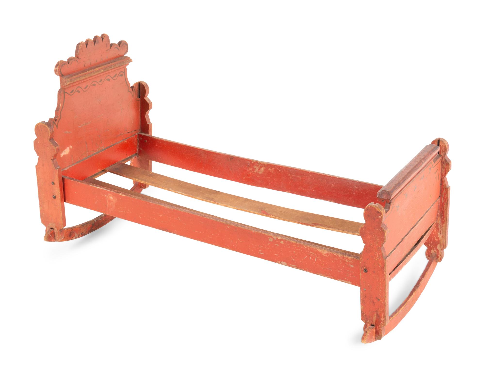A Scandinavian Painted Pine Doll's Bed