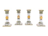 A Set of Four French Faience Candlesticks