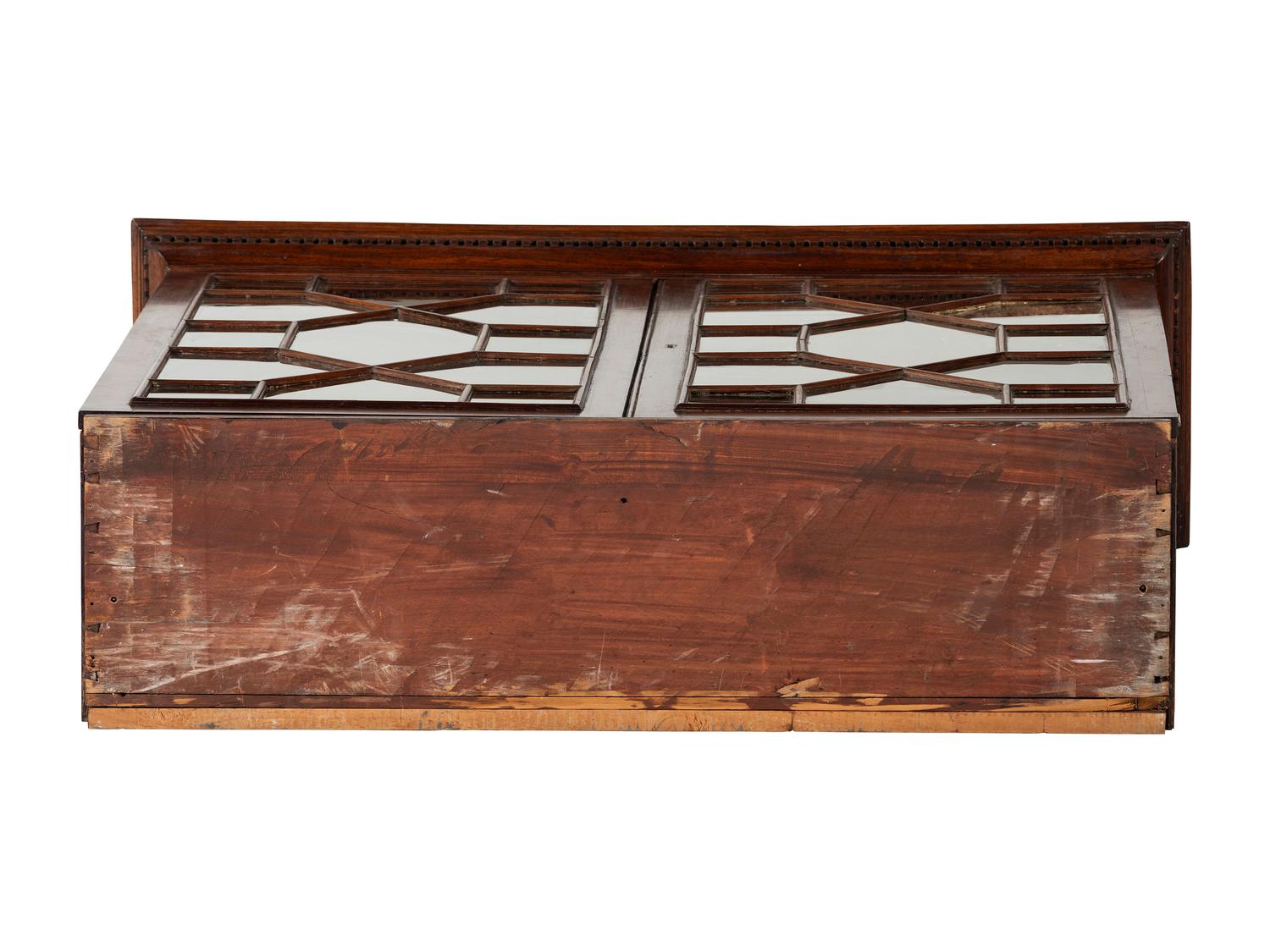 A Chippendale Mahogany and Cherrywood Serpentine Claw-and-Ball Foot Desk-and-Bookcase