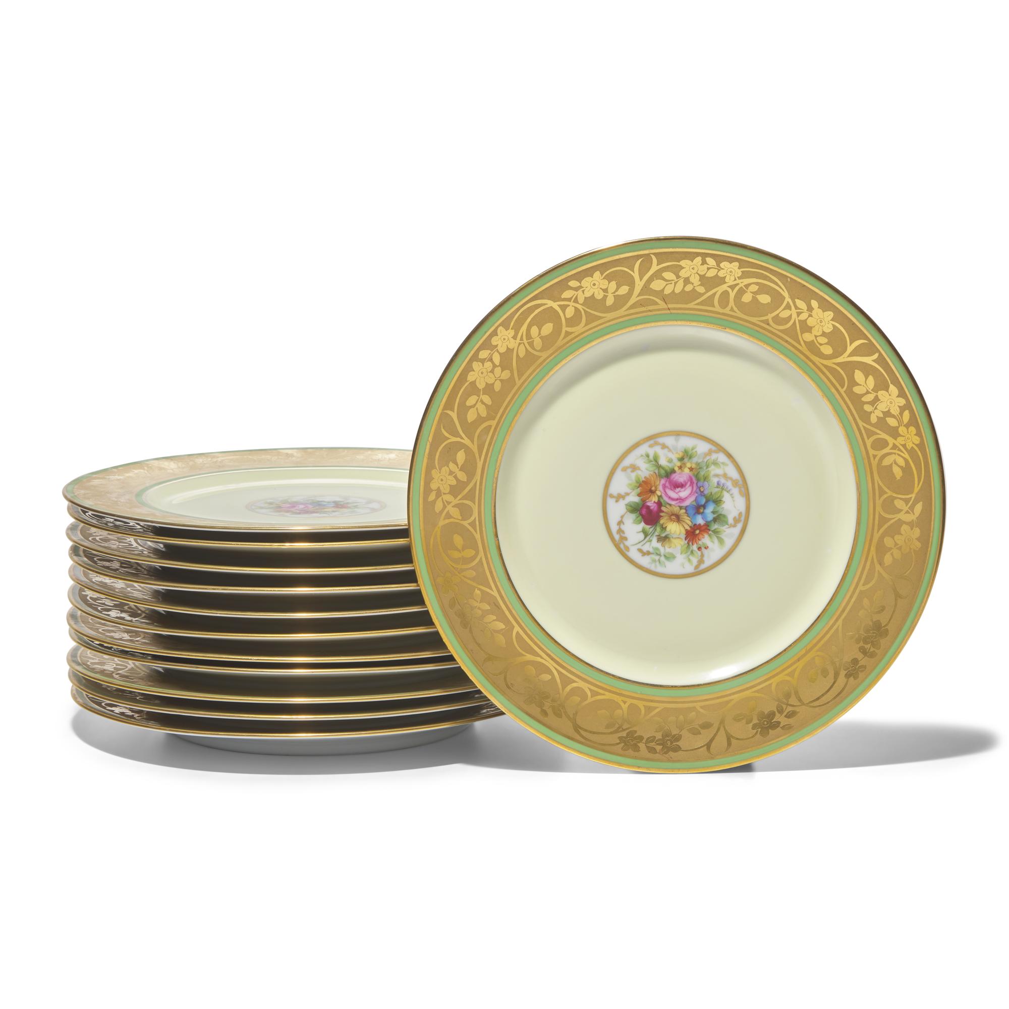 A Set of Twelve Limoges Porcelain Chargers