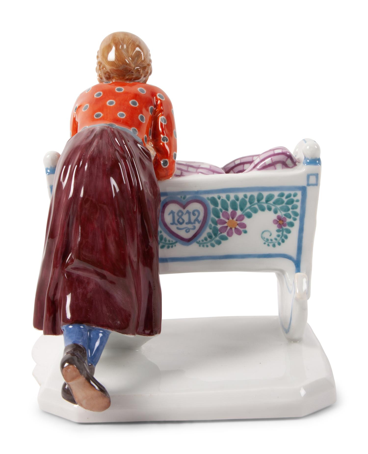 A Meissen Porcelain Figural Group of a Woman with Cradle