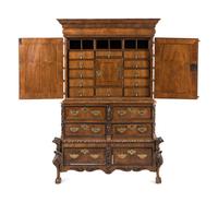 A Continental Baroque Brass Mounted Walnut Cabinet on Chest