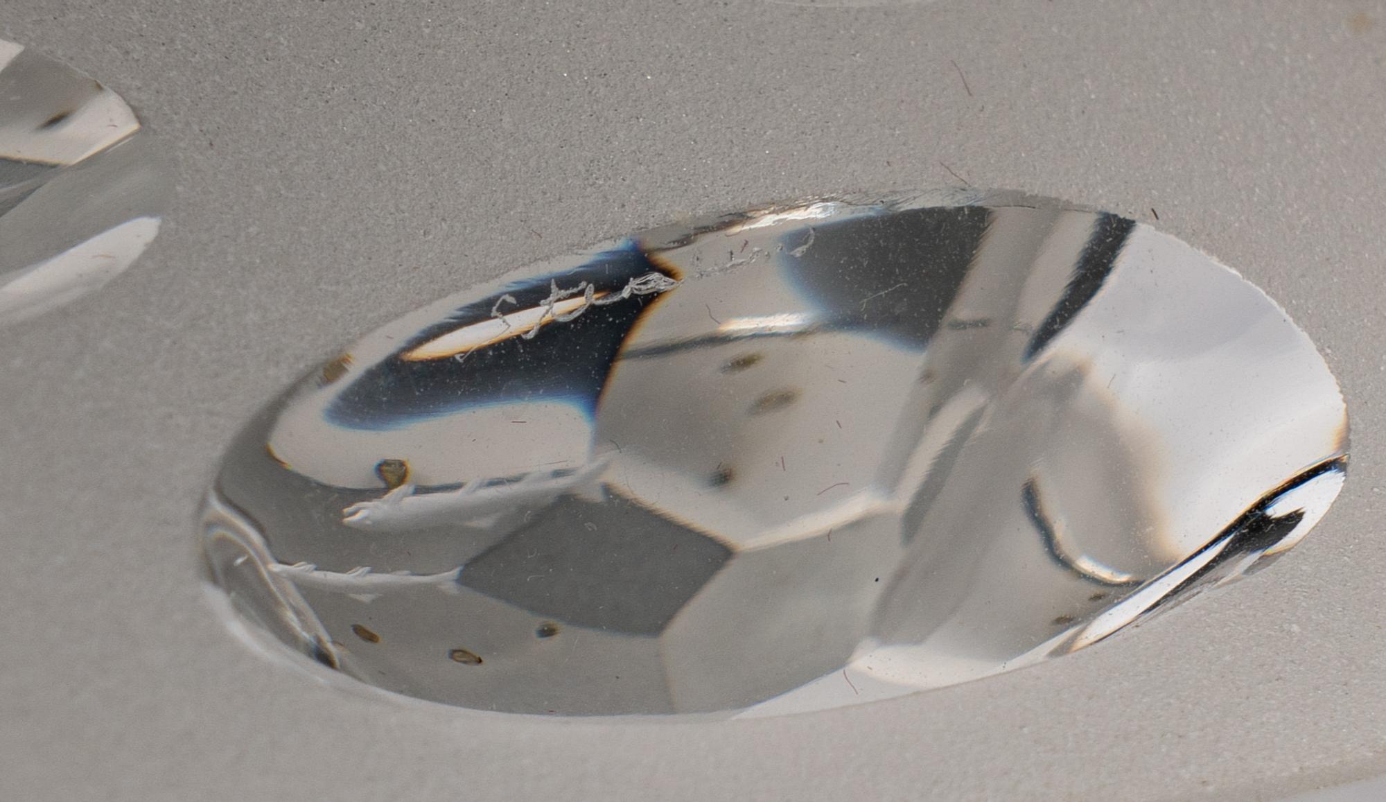 A Steuben Engraved Glass and Silver Arctic Fisherman Sculpture