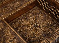 An Italian Parcel Gilt and Carved Walnut Orpheus and Eurydice Casket