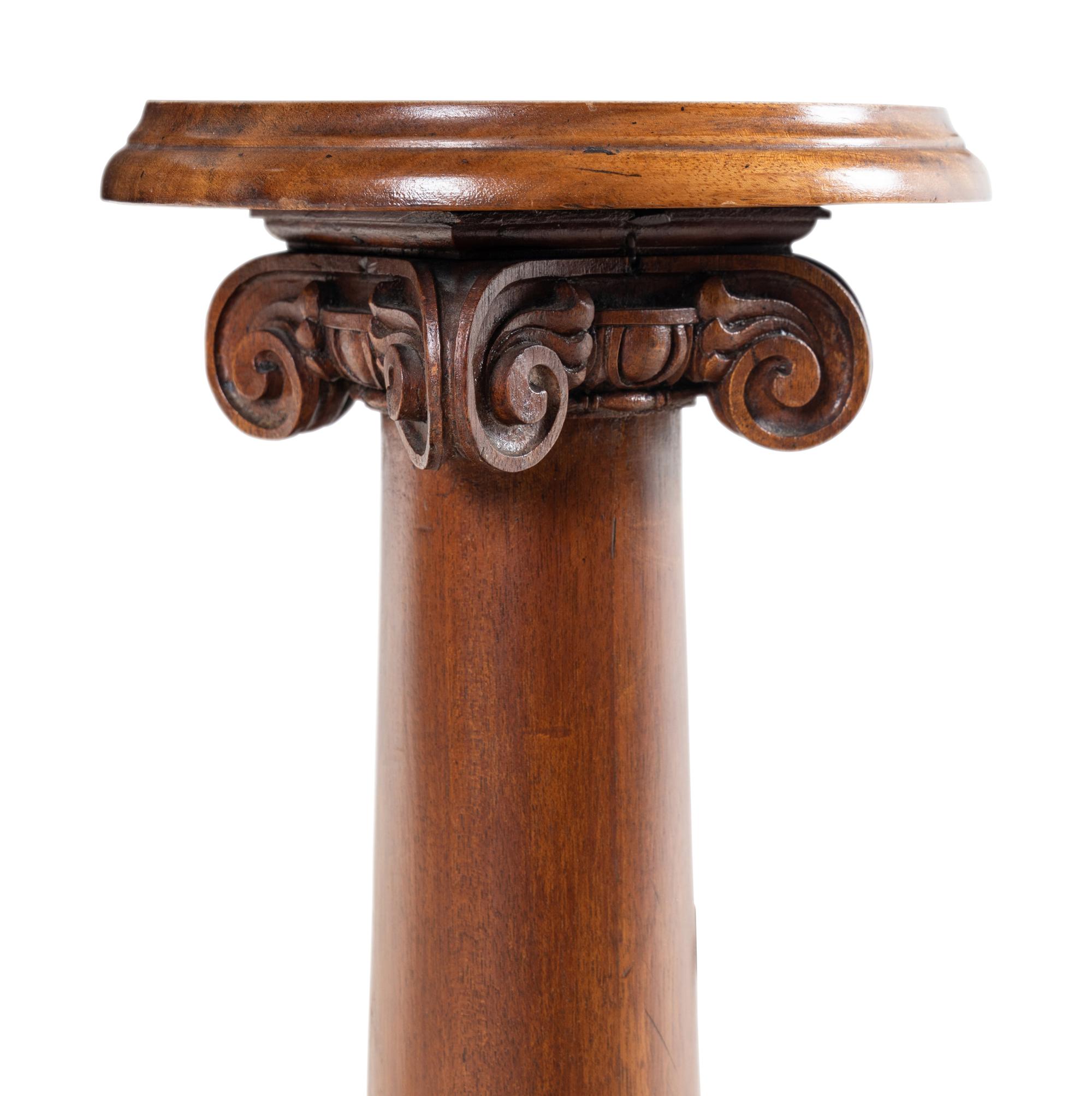 A Carved Mahogany Pedestal