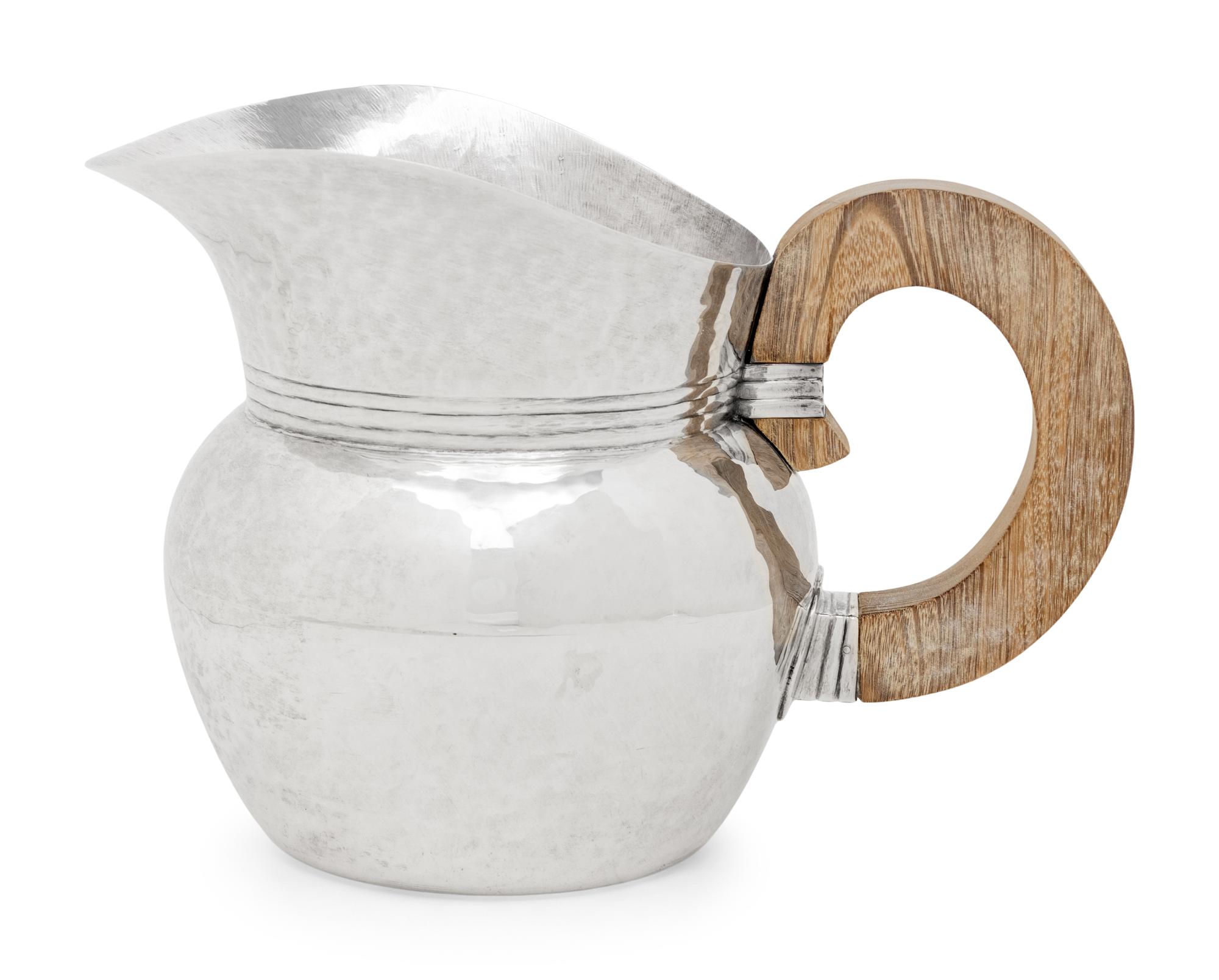 A Mexican Silver Water Pitcher