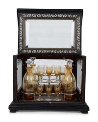 A French Ebonized and Inlaid Cave à Liqueur with Amber Glass Decanters — LATE 19TH CENTURY