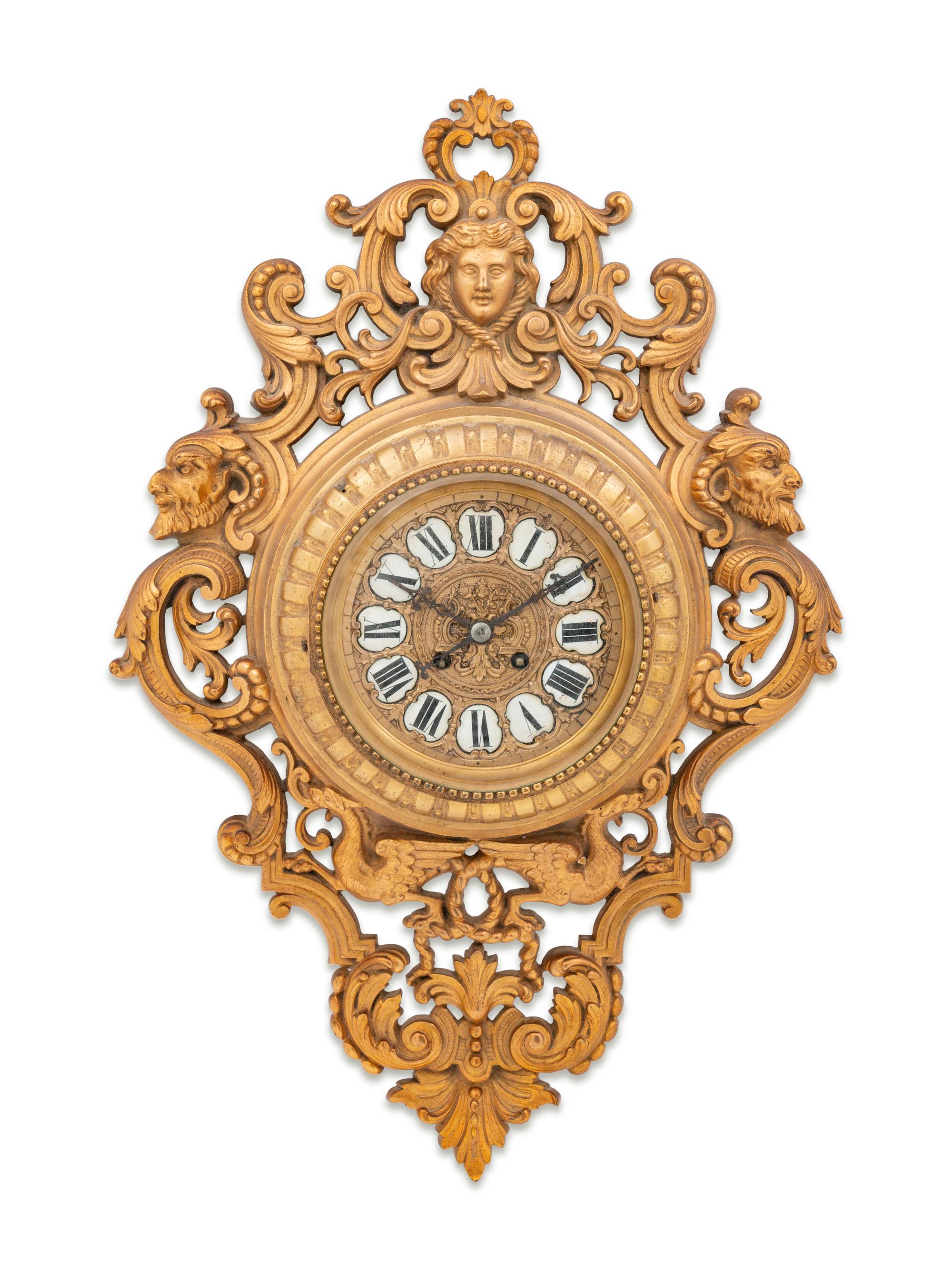 A Neoclassical Gilt Metal Cartel Clock