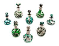 A Group of Eight Silver Overlay Glass Bottles Height of tallest 4 1/2 inches.