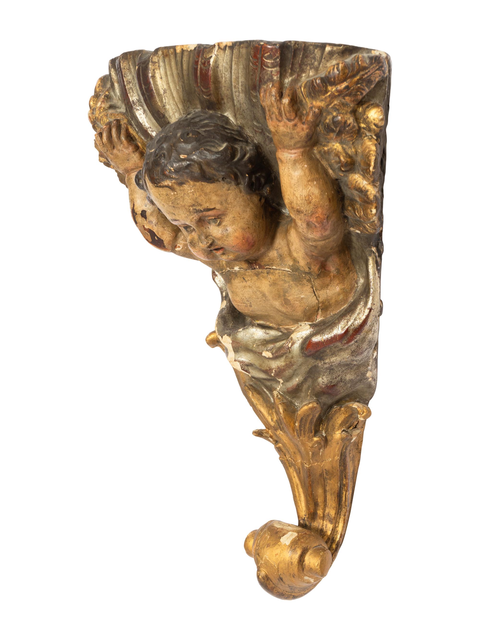 An Italian Carved and Polychrome Decorated Corner Wall Bracket