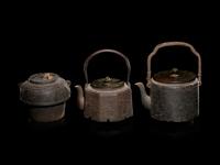 Seven Japanese Cast Iron Teapots, Tetsubin, and Burner