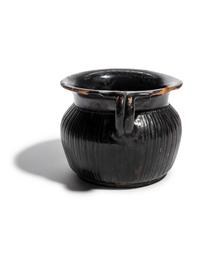 A Greek Black-Glazed Ribbed Mug
