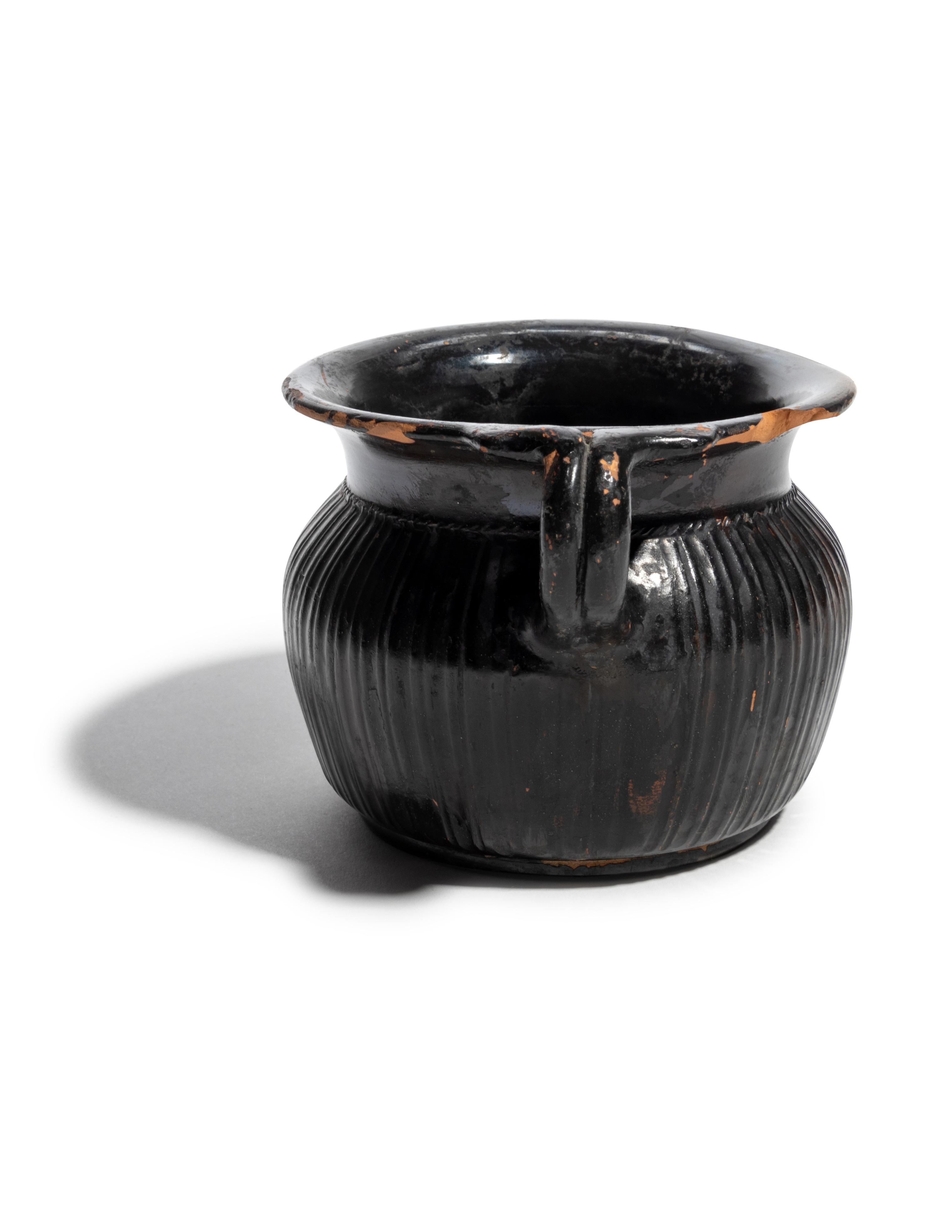 A Greek Black-Glazed Ribbed Mug