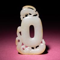 A Chinese Russet and White Jade 'Chilong' Pendant, 18th/19th Century — 清中期 白玉留皮螭龍紋佩